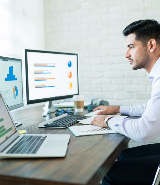 Student learning MS Office tools including Word, Excel, PowerPoint, and Outlook on computer